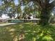 Charming one story house with a large tree in the front yard at 6740 Odoniel W Loop, Lakeland, FL 33809