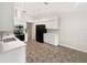 Updated kitchen with new white cabinets, stainless steel appliances, quartz countertops, and modern flooring at 6740 Odoniel W Loop, Lakeland, FL 33809