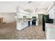 Modern kitchen with white cabinets, stainless steel appliances, and updated countertops at 6740 Odoniel W Loop, Lakeland, FL 33809