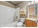 Clean bathroom with a tub, toilet, and vanity at 7263 Spring Villas Cir, Orlando, FL 32819