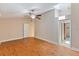 Spacious bedroom with wood floors, high ceiling, and ensuite bathroom for comfortable living at 7263 Spring Villas Cir, Orlando, FL 32819