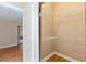 Walk-in closet featuring wire shelving and wood floors located off of the main bedroom at 7263 Spring Villas Cir, Orlando, FL 32819