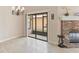 Bright living room featuring a fireplace, tile floors, and access to the lanai at 7263 Spring Villas Cir, Orlando, FL 32819