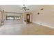 Spacious living room featuring tile floors, vaulted ceilings, and front door at 7263 Spring Villas Cir, Orlando, FL 32819