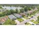 Aerial view showcasing a home's location in a neighborhood with nearby lake access and lush greenery at 7809 Altavan Ave, Orlando, FL 32822