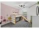 Fun bedroom with loft bed, play area, and carpeted floors at 7809 Altavan Ave, Orlando, FL 32822
