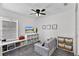 Cozy bedroom with built-in storage, window seating, and comfortable furniture at 7809 Altavan Ave, Orlando, FL 32822