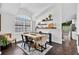 Bright dining room with large windows and stylish decor at 7809 Altavan Ave, Orlando, FL 32822