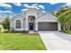Charming single-Gathering home boasts meticulous landscaping and a two-car garage at 7809 Altavan Ave, Orlando, FL 32822
