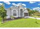 Attractive home featuring a well-manicured lawn and inviting front entrance at 7809 Altavan Ave, Orlando, FL 32822