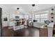Modern kitchen with white cabinets, granite countertops, and a breakfast bar at 7809 Altavan Ave, Orlando, FL 32822