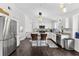 Contemporary kitchen with stainless steel refrigerator and island with barstool seating at 7809 Altavan Ave, Orlando, FL 32822