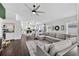 Open-concept living room with a large sectional sofa and modern design at 7809 Altavan Ave, Orlando, FL 32822