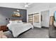 Comfortable main bedroom featuring accent wall, stylish decor, and a tranquil atmosphere at 7809 Altavan Ave, Orlando, FL 32822