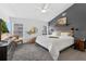 Relaxing main bedroom with neutral tones, accent wall, and ample natural light at 7809 Altavan Ave, Orlando, FL 32822