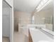Well-lit bathroom featuring double vanity, soaking tub and separate shower stall at 7952 Oakstone Ct, Orlando, FL 32822