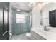 Bathroom with a glass-enclosed shower featuring stylish tile and modern fixtures, complemented by a sleek vanity at 7952 Oakstone Ct, Orlando, FL 32822