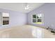 Cozy bedroom with neutral walls, ceiling fan, and natural light from two windows at 7952 Oakstone Ct, Orlando, FL 32822