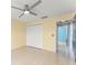 Bedroom featuring tile flooring, a ceiling fan, and a closet, offering ample storage space at 7952 Oakstone Ct, Orlando, FL 32822