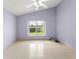 Tranquil bedroom with ceiling fan, neutral walls, and bright natural light at 7952 Oakstone Ct, Orlando, FL 32822