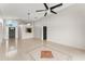 Open-concept living room featuring neutral paint, tile floors, and high ceilings at 7952 Oakstone Ct, Orlando, FL 32822