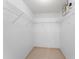Walk-in closet with wire shelving and tile flooring for optimal storage at 7952 Oakstone Ct, Orlando, FL 32822