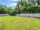 Spacious backyard with lush green grass and a wood fence at 8994 Fort Jefferson Blvd, Orlando, FL 32822