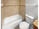 Bathroom featuring a tiled shower and bathtub combination, with a modern toilet at 8994 Fort Jefferson Blvd, Orlando, FL 32822