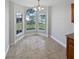 Charming dining area with a bay window offering a view of the front yard at 8994 Fort Jefferson Blvd, Orlando, FL 32822