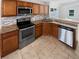 Stylish kitchen with stainless steel appliances and granite countertops with tiled backsplash at 8994 Fort Jefferson Blvd, Orlando, FL 32822