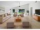 Bright living room with vaulted ceilings, neutral furniture, and tiled floors at 8994 Fort Jefferson Blvd, Orlando, FL 32822