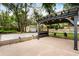 Backyard featuring an outdoor patio with a pergola, string lights, and a storage shed at 917 Southern Oak Ln, Apopka, FL 32712
