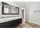 Modern bathroom with sleek vanity, mosaic tile backsplash, and a large mirror at 917 Southern Oak Ln, Apopka, FL 32712