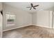 Bedroom featuring tile floors, a window with a view, and neutral paint throughout at 917 Southern Oak Ln, Apopka, FL 32712