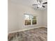 Cozy bedroom with wood-look flooring, a ceiling fan and natural light at 917 Southern Oak Ln, Apopka, FL 32712