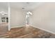Open dining area featuring wood-look tile floors and modern pendant lighting at 917 Southern Oak Ln, Apopka, FL 32712