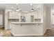 Bright kitchen featuring white cabinets, granite counters, stylish backsplash and stainless steel appliances at 917 Southern Oak Ln, Apopka, FL 32712