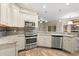 Kitchen with stainless steel appliances, granite countertops and updated cabinetry at 917 Southern Oak Ln, Apopka, FL 32712