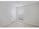 Cozy bedroom with neutral paint, ceramic tile floors, window, and ceiling fan at 1026 Mccully Ct, Oviedo, FL 32765