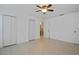 Bright bedroom with two closets and access to the bathroom featuring ceramic tile floors at 1026 Mccully Ct, Oviedo, FL 32765