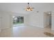 Living area with tile floors and sliding glass doors providing backyard access, offering a seamless indoor/outdoor experience at 1026 Mccully Ct, Oviedo, FL 32765