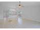 Spacious living room with tile flooring, connecting seamlessly to the kitchen, ideal for entertaining at 1026 Mccully Ct, Oviedo, FL 32765