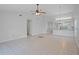 Expansive living room with modern tile flooring, blending seamlessly into the dining and kitchen areas at 1026 Mccully Ct, Oviedo, FL 32765