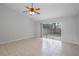 Bright living room featuring tile floors and sliding glass doors to the backyard, perfect for indoor-outdoor living at 1026 Mccully Ct, Oviedo, FL 32765