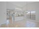 Bright living space with tile floors, leading to an open kitchen, perfect for modern living at 1026 Mccully Ct, Oviedo, FL 32765