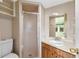 Standard bathroom featuring a glass enclosed shower, tile walls and floors, and a wood vanity at 110 N Sunland Dr, Sanford, FL 32773