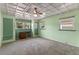 This charming bedroom features bright green walls, ample natural light, and unique textured ceiling at 110 N Sunland Dr, Sanford, FL 32773