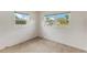 Clean bedroom with large windows providing plenty of natural light at 110 N Sunland Dr, Sanford, FL 32773