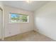 Clean bedroom with a window overlooking the front yard providing plenty of natural light at 110 N Sunland Dr, Sanford, FL 32773