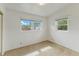 Bright bedroom with two windows providing plenty of natural light at 110 N Sunland Dr, Sanford, FL 32773
